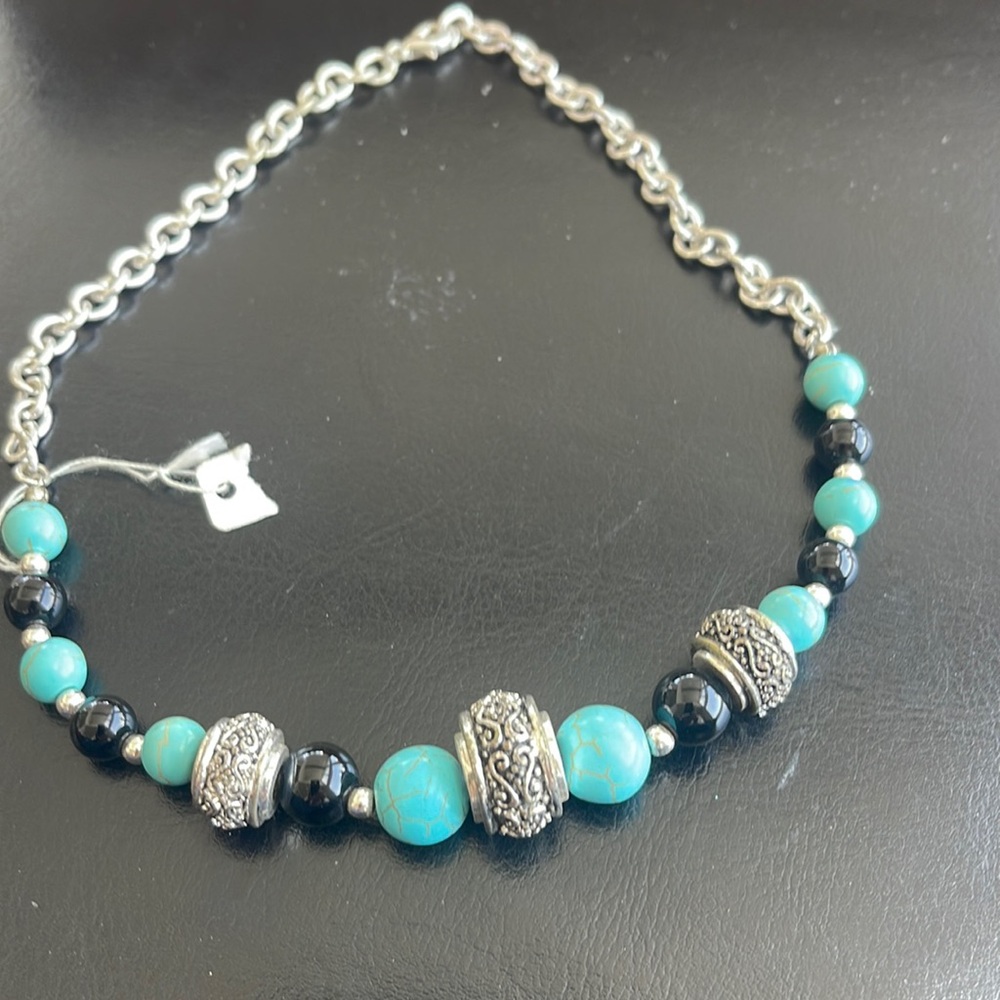 Cute black necklace with turquoise color balls. 17”